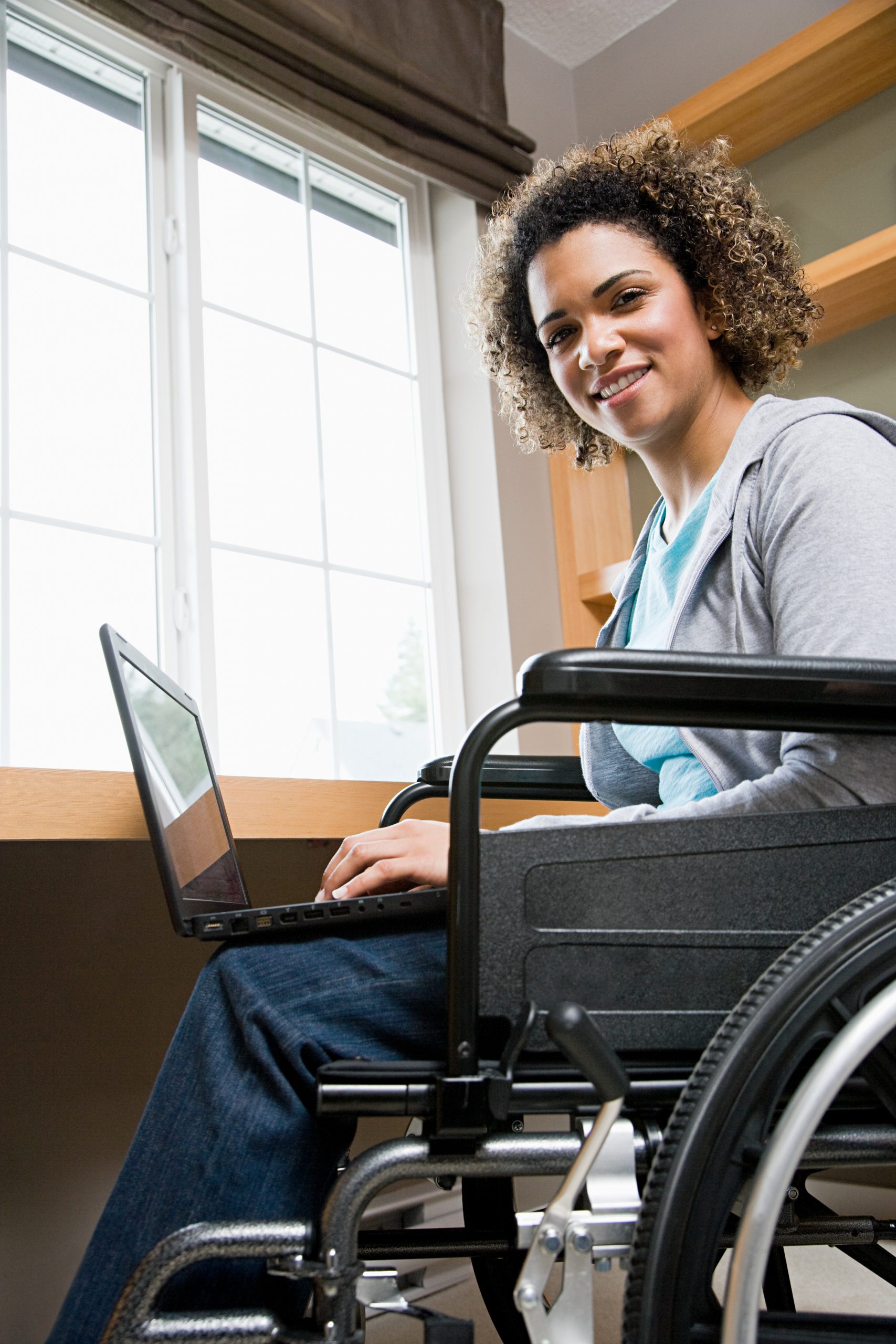 Disabled woman using a laptop computer